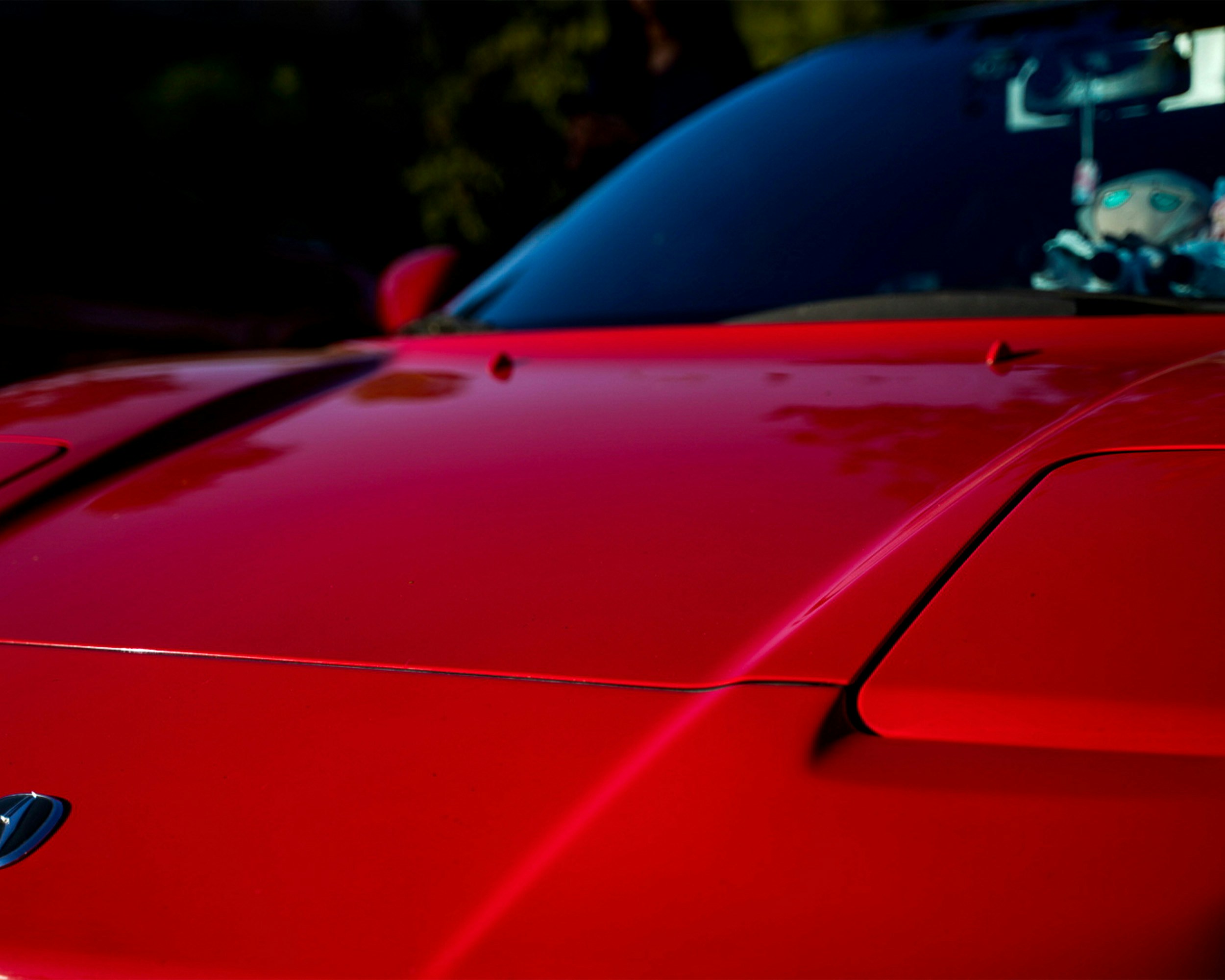 A red Acura sports sedan.