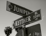 a black and white photo of a street sign
