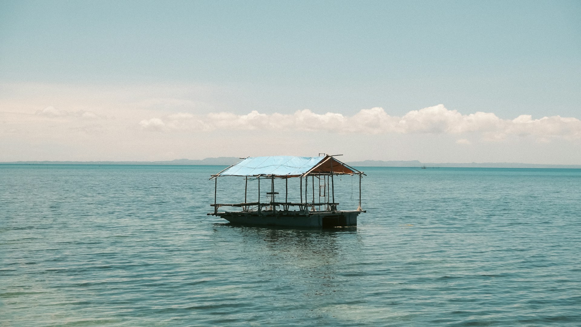 a boat floating on top of a large body of water