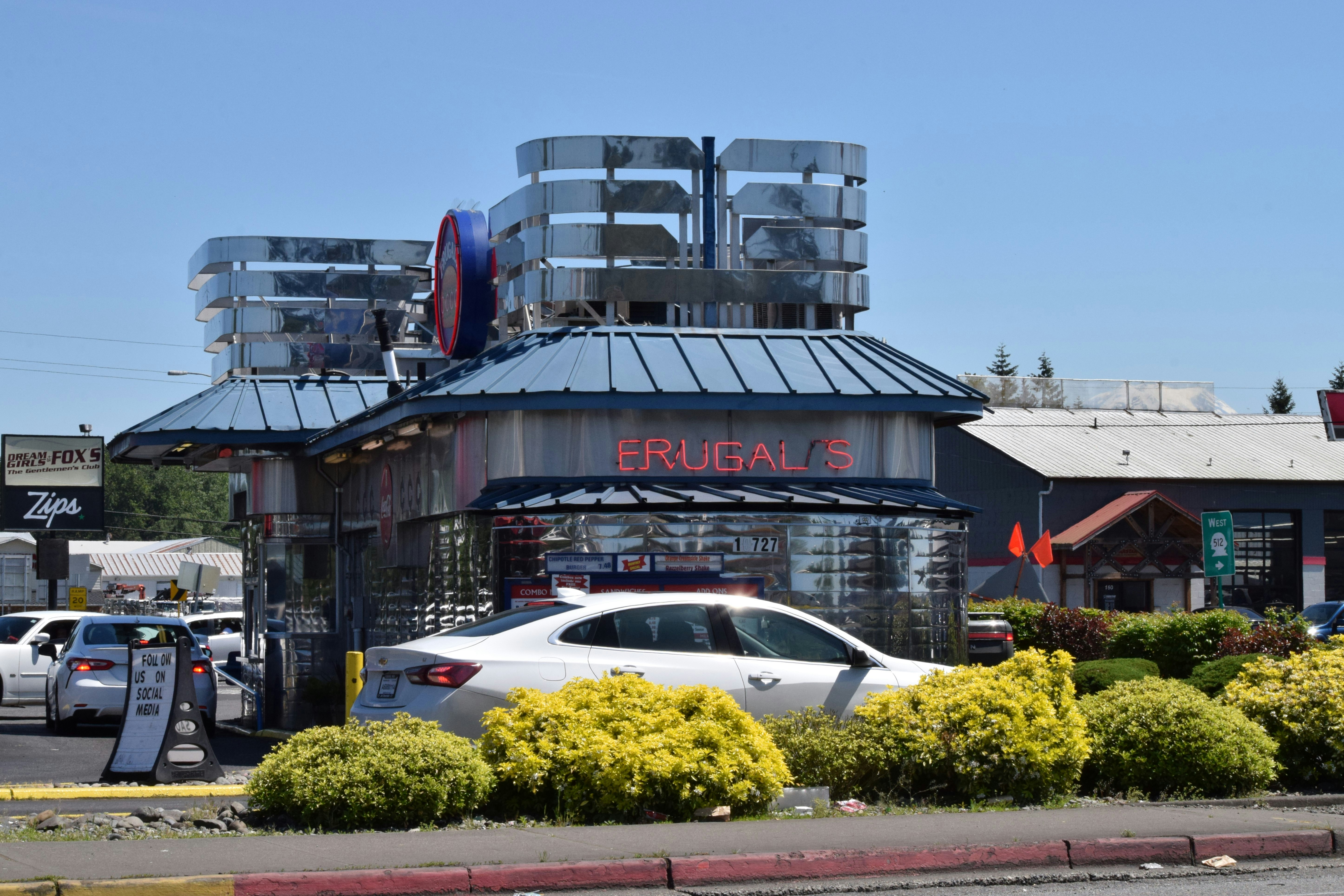 a car is parked in front of a building
