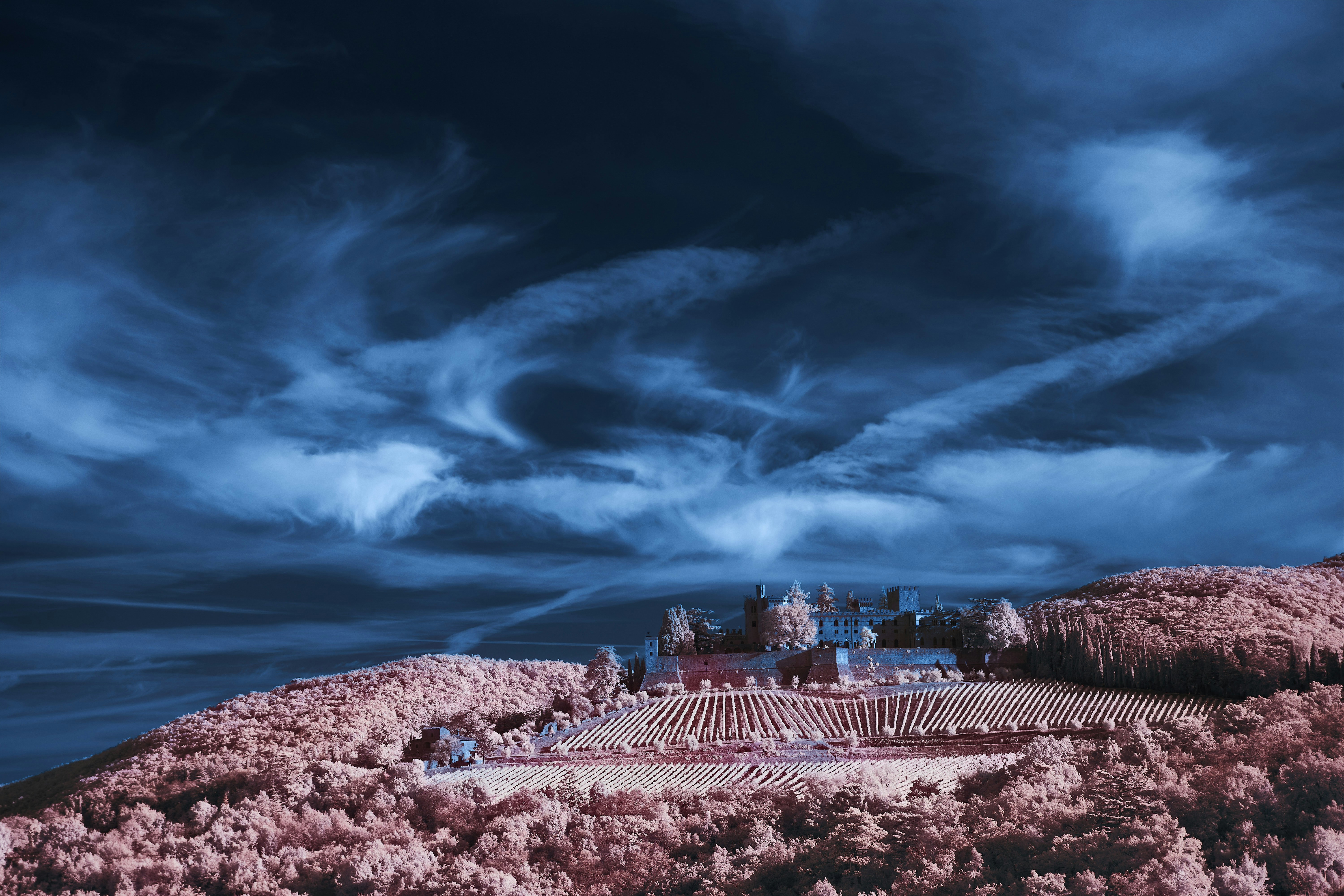 A castle on top of a hill under a cloudy sky photo – Free Castle Image ...