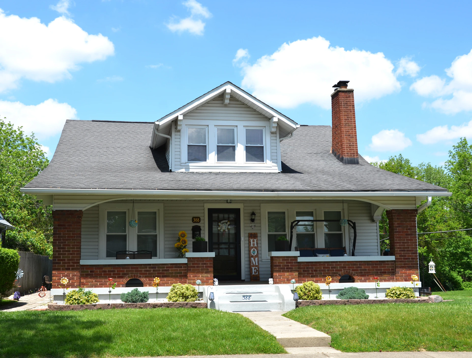 a white house with a black roof and white trim