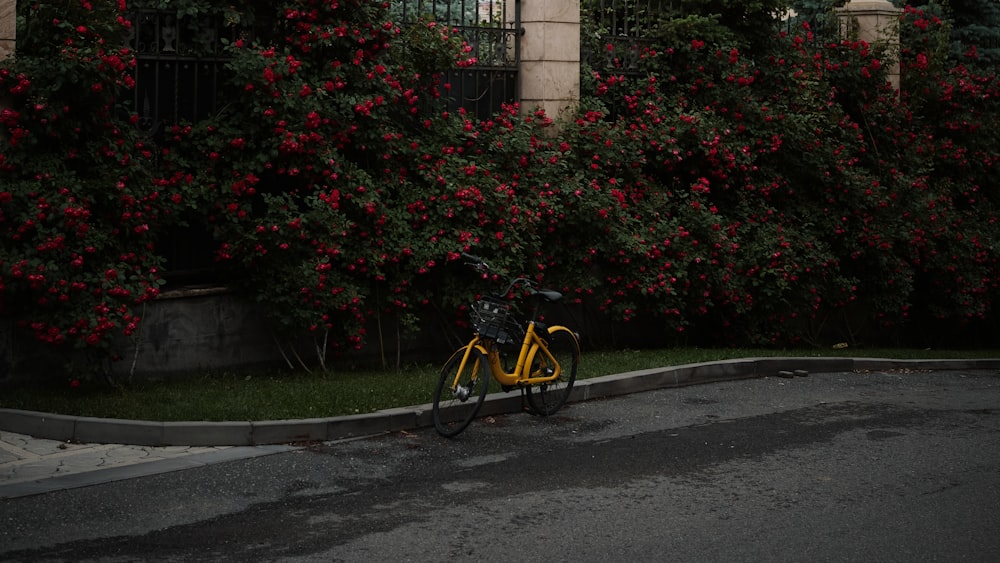 a yellow bicycle parked on the side of the road