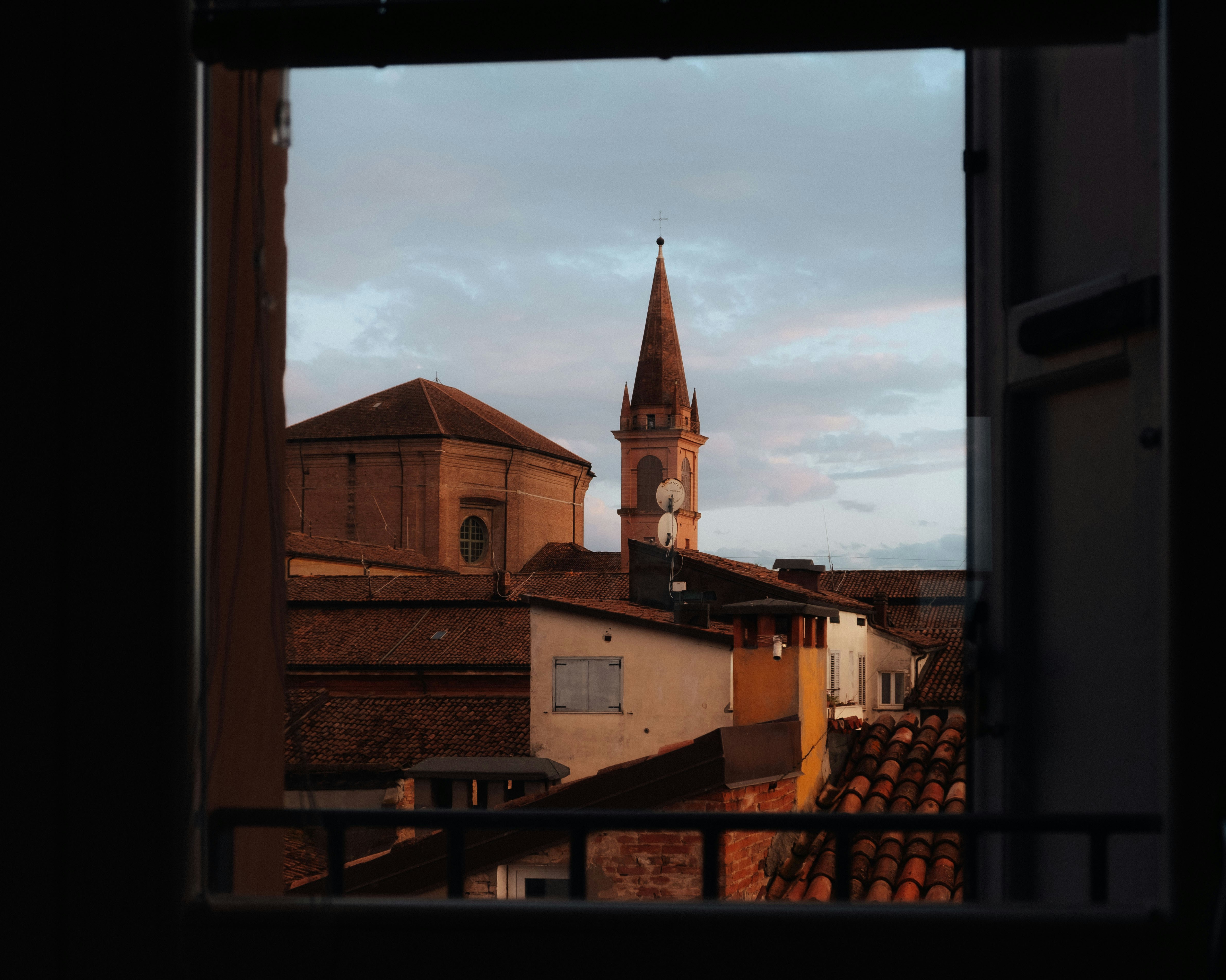 a view of a church tower from a window, 