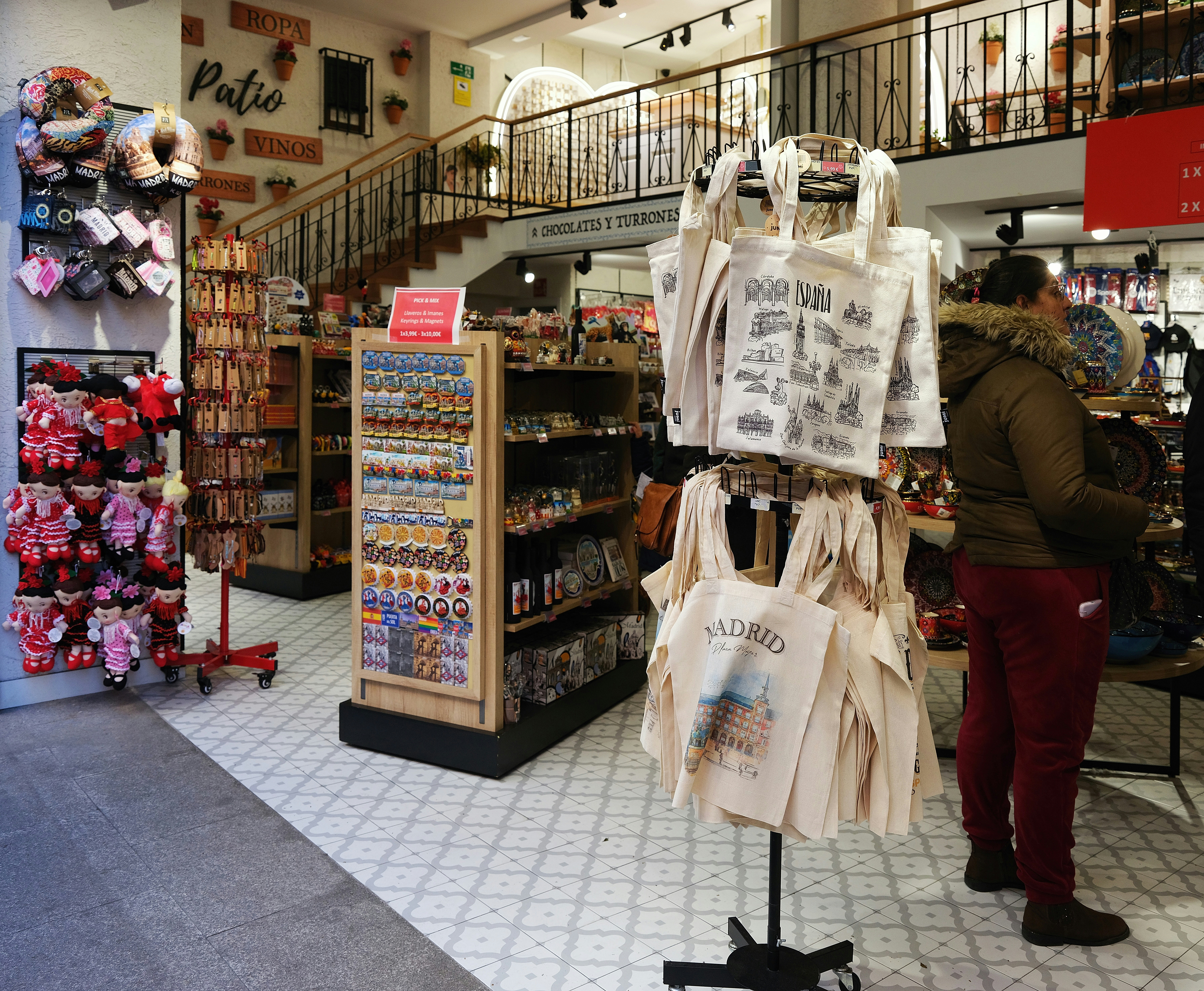 a woman looking at a display in a store