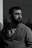 a black and white photo of a man with a beard