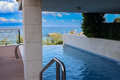 a swimming pool with a view of the ocean