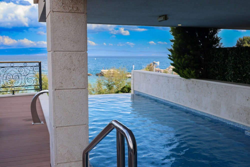 a swimming pool with a view of the ocean
