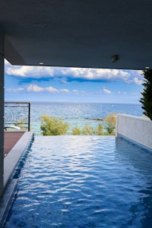 a swimming pool with a view of the ocean