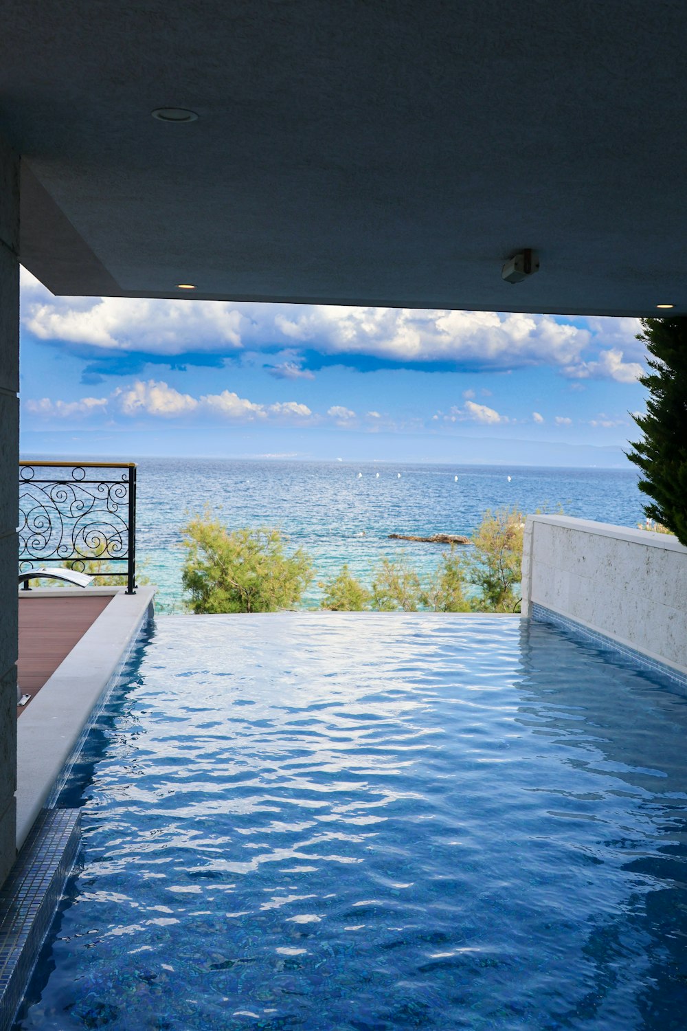a swimming pool with a view of the ocean