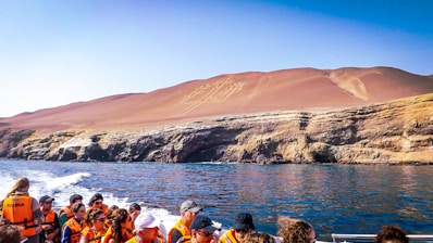 a group of people on a boat in the water