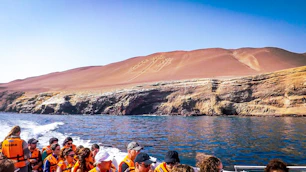a group of people on a boat in the water