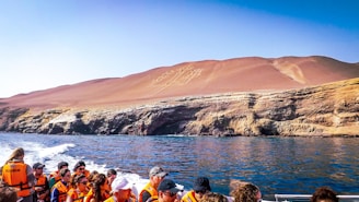 a group of people on a boat in the water