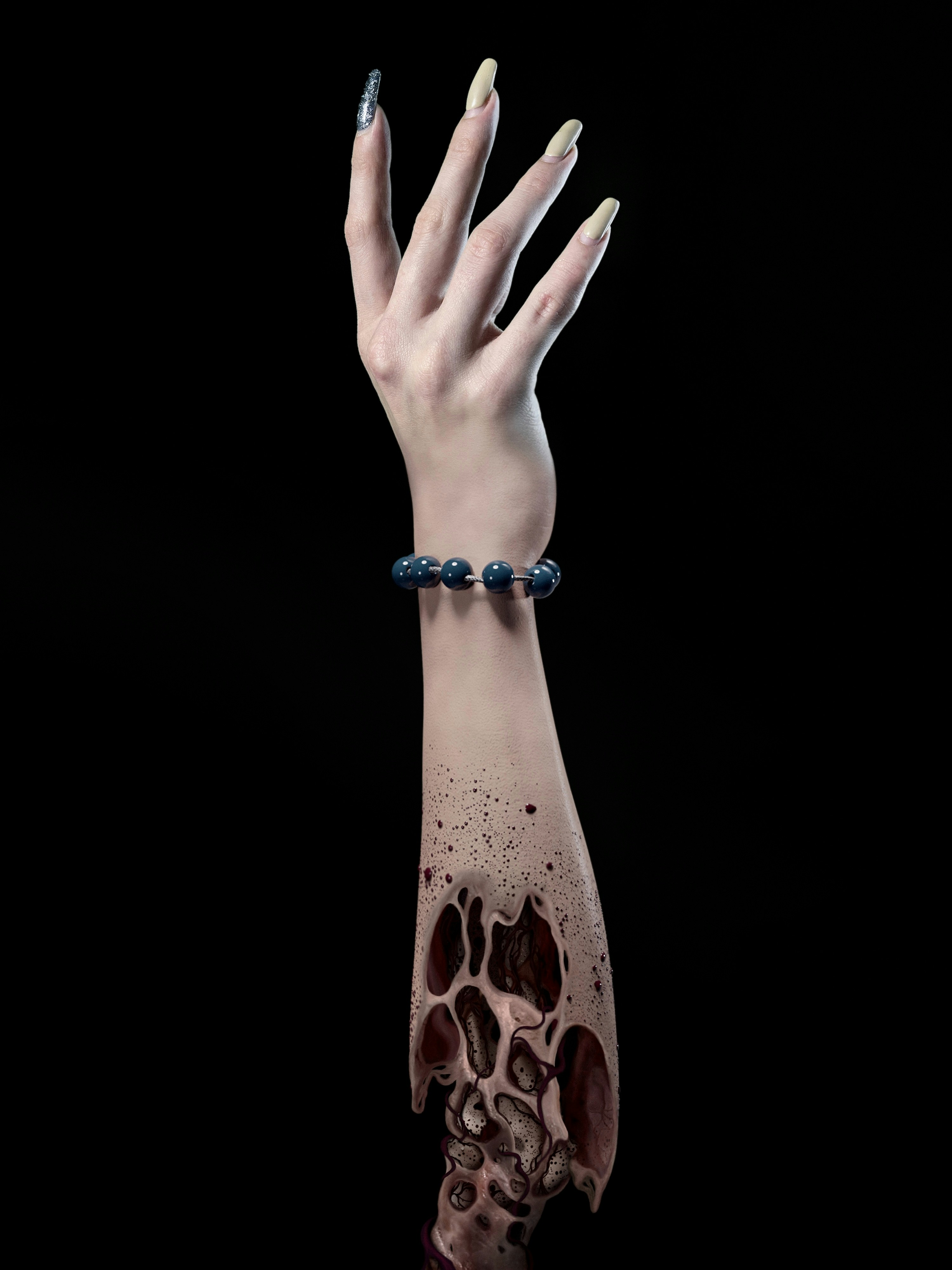 a woman's hand with a bracelet on it