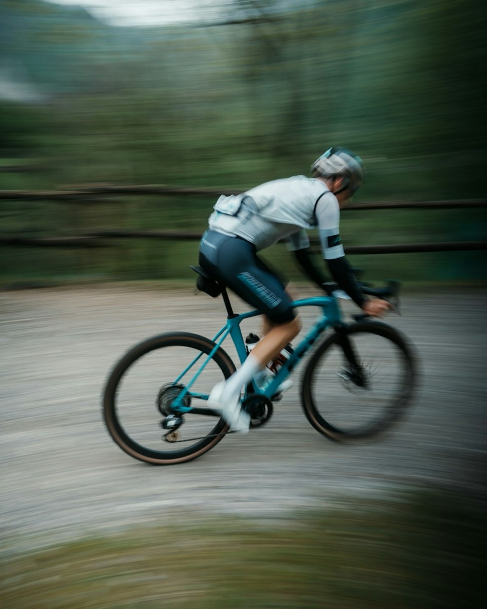 a blurry photo of a man riding a bike