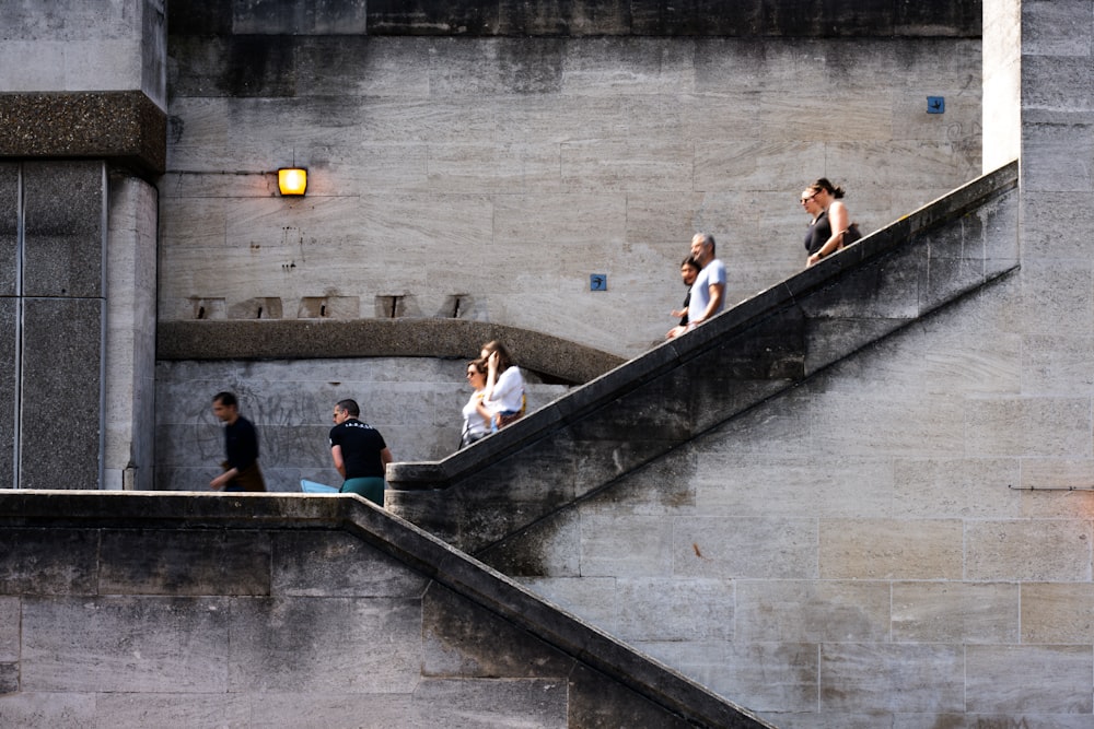 a group of people walking down a flight of stairs