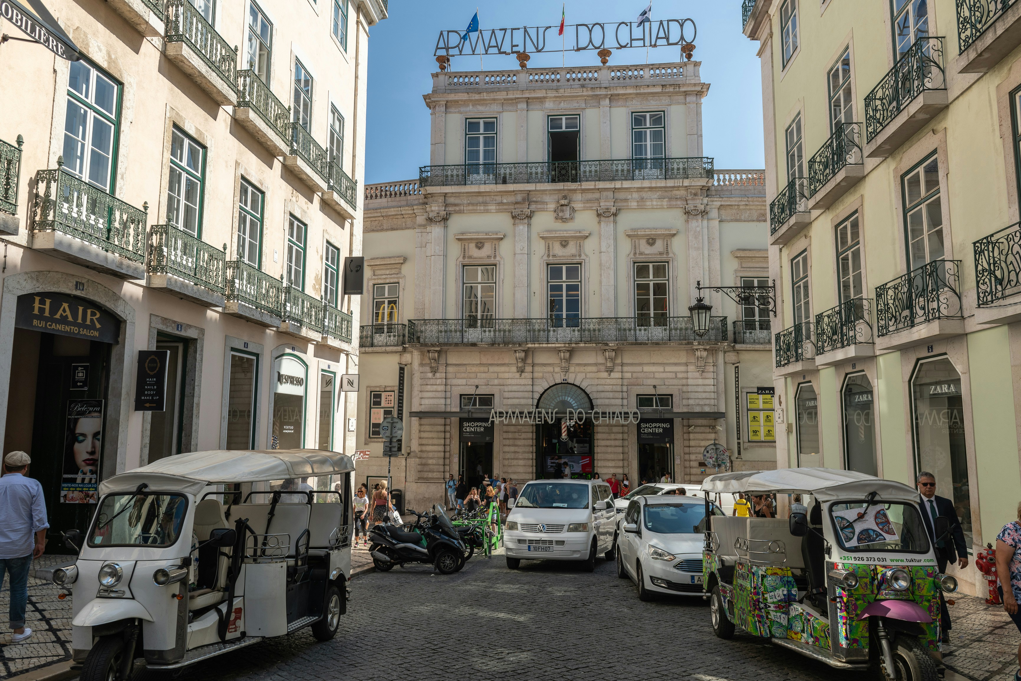 a group of vehicles parked in front of a building