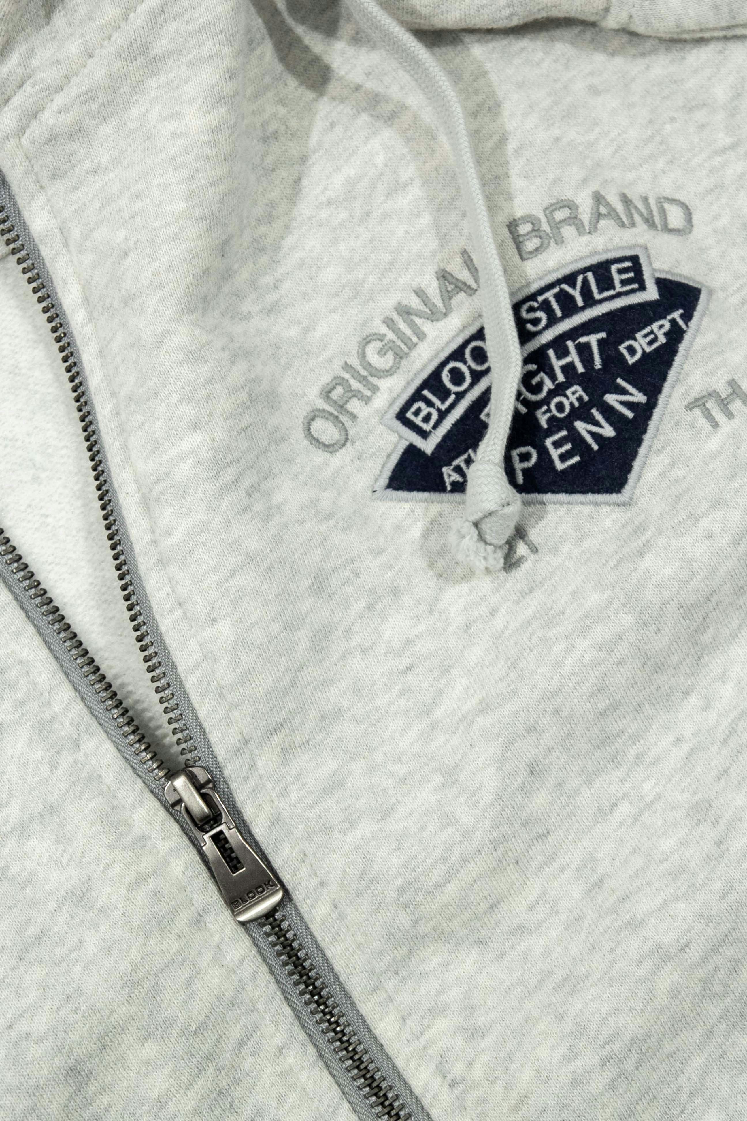 Yellow zip hoodie product shot, dark background, bold color contrast