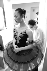 a woman in a dress is standing in a room