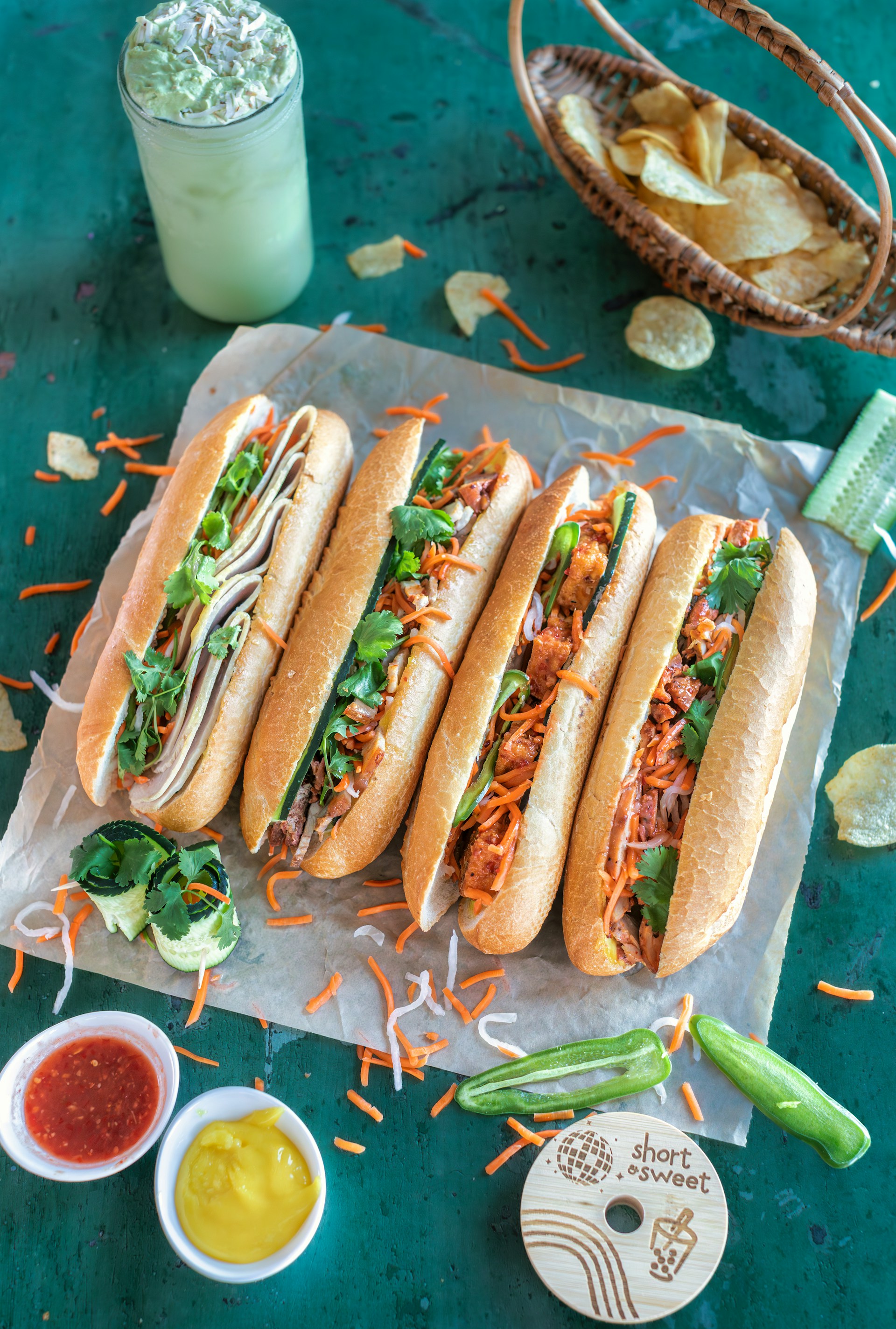 a bunch of hot dogs sitting on top of a table
