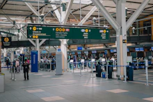 Travellers in a bright modern airport terminal