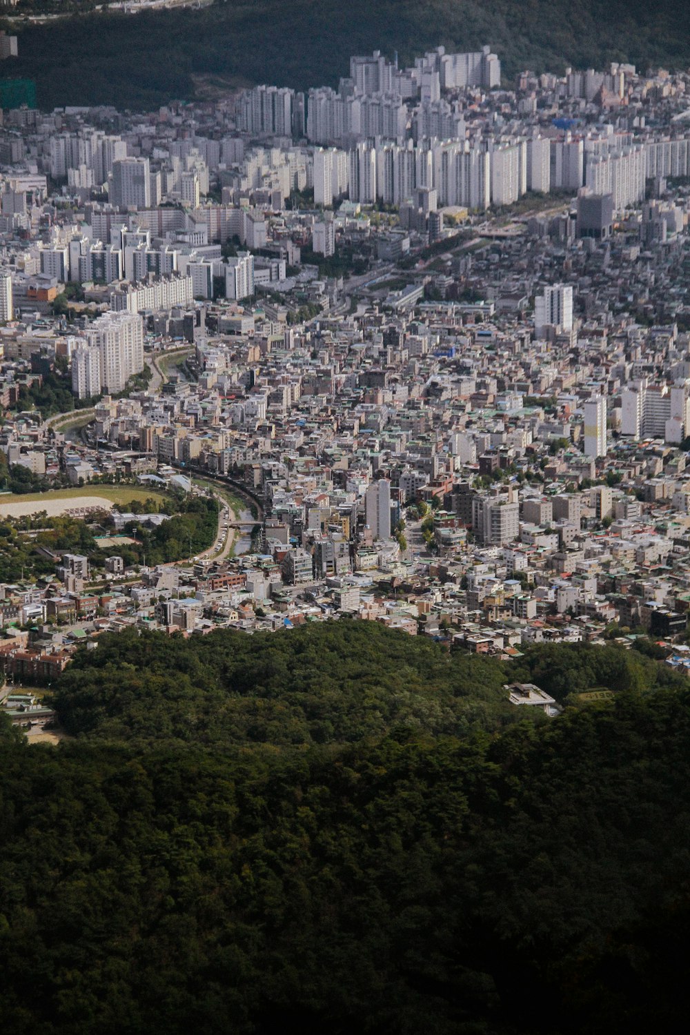 an aerial view of a large city with lots of tall buildings