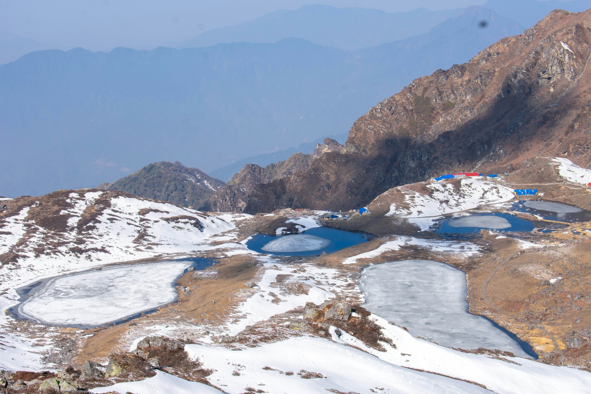a view of a mountain with a lake in the middle of it