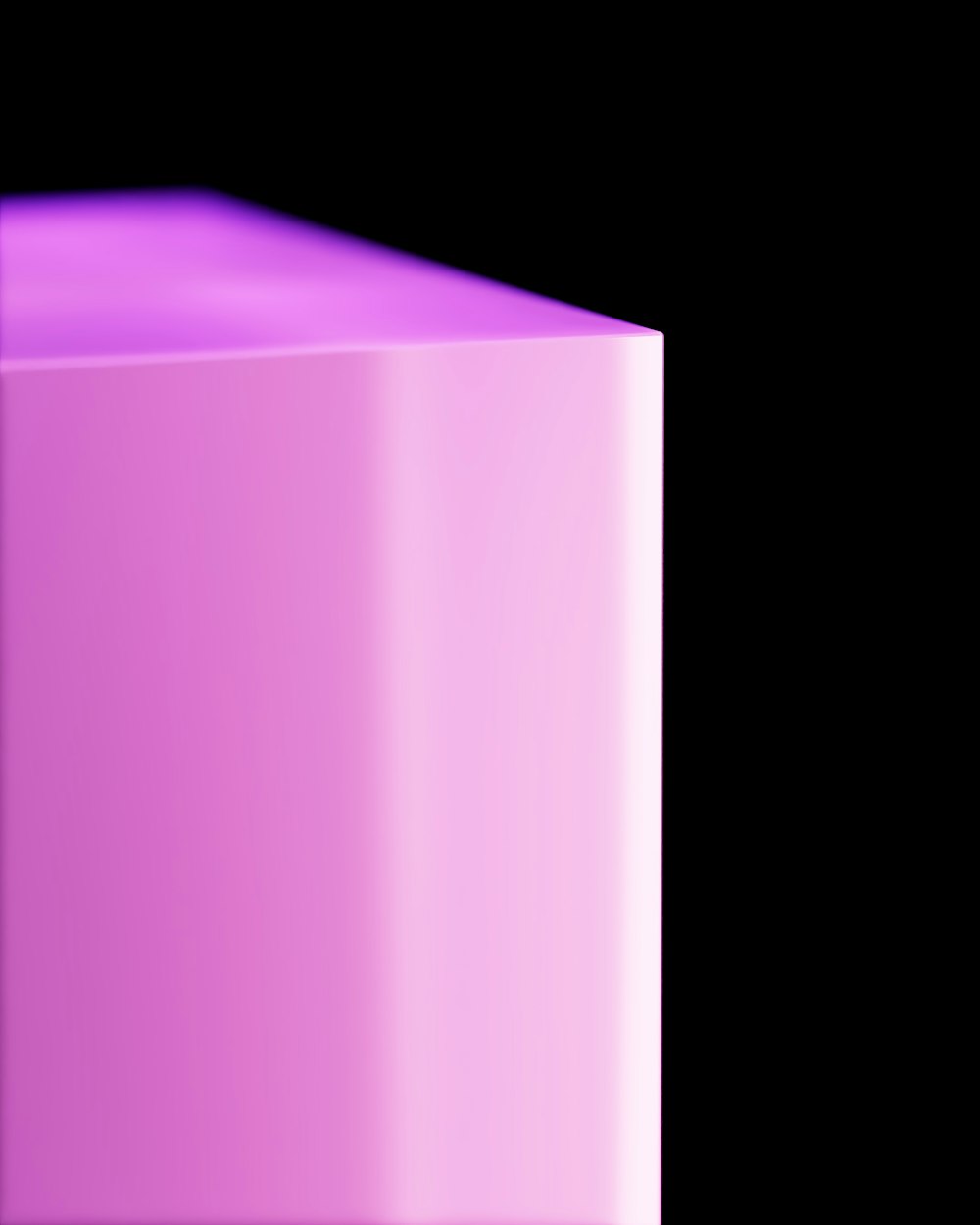 a close up of a pink cube on a black background