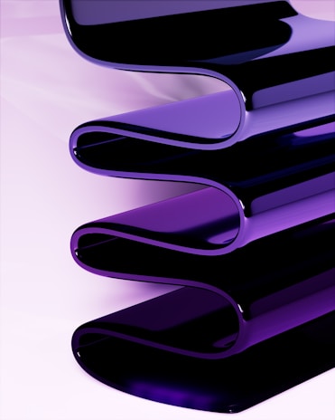 a close up of a purple object on a white surface