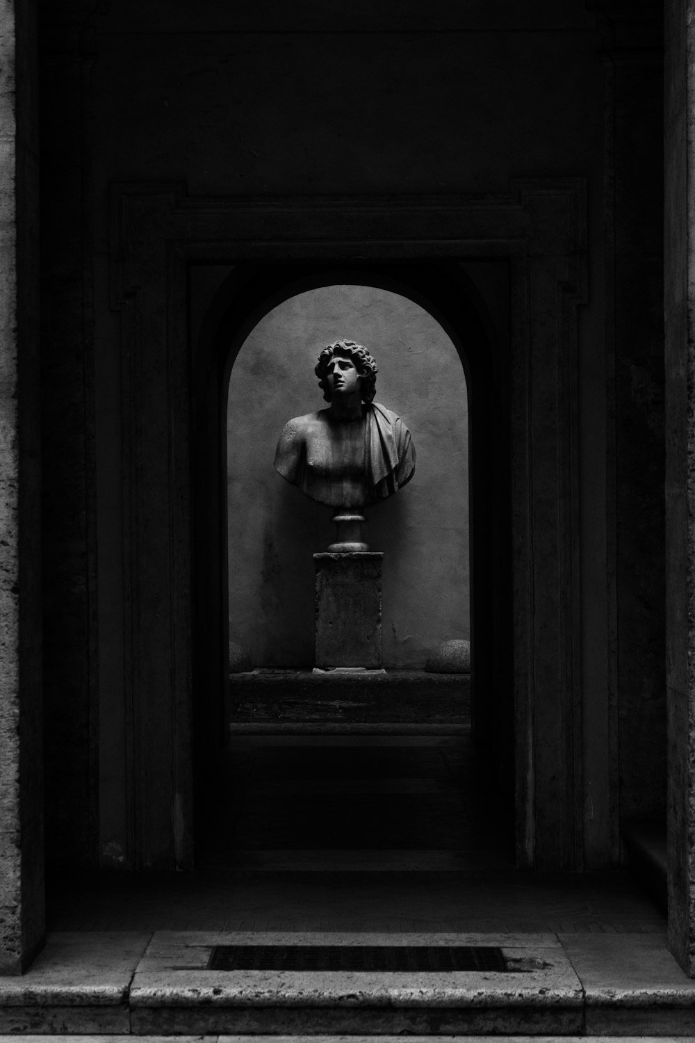 a black and white photo of a statue