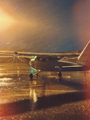 a small airplane sitting on top of an airport tarmac
