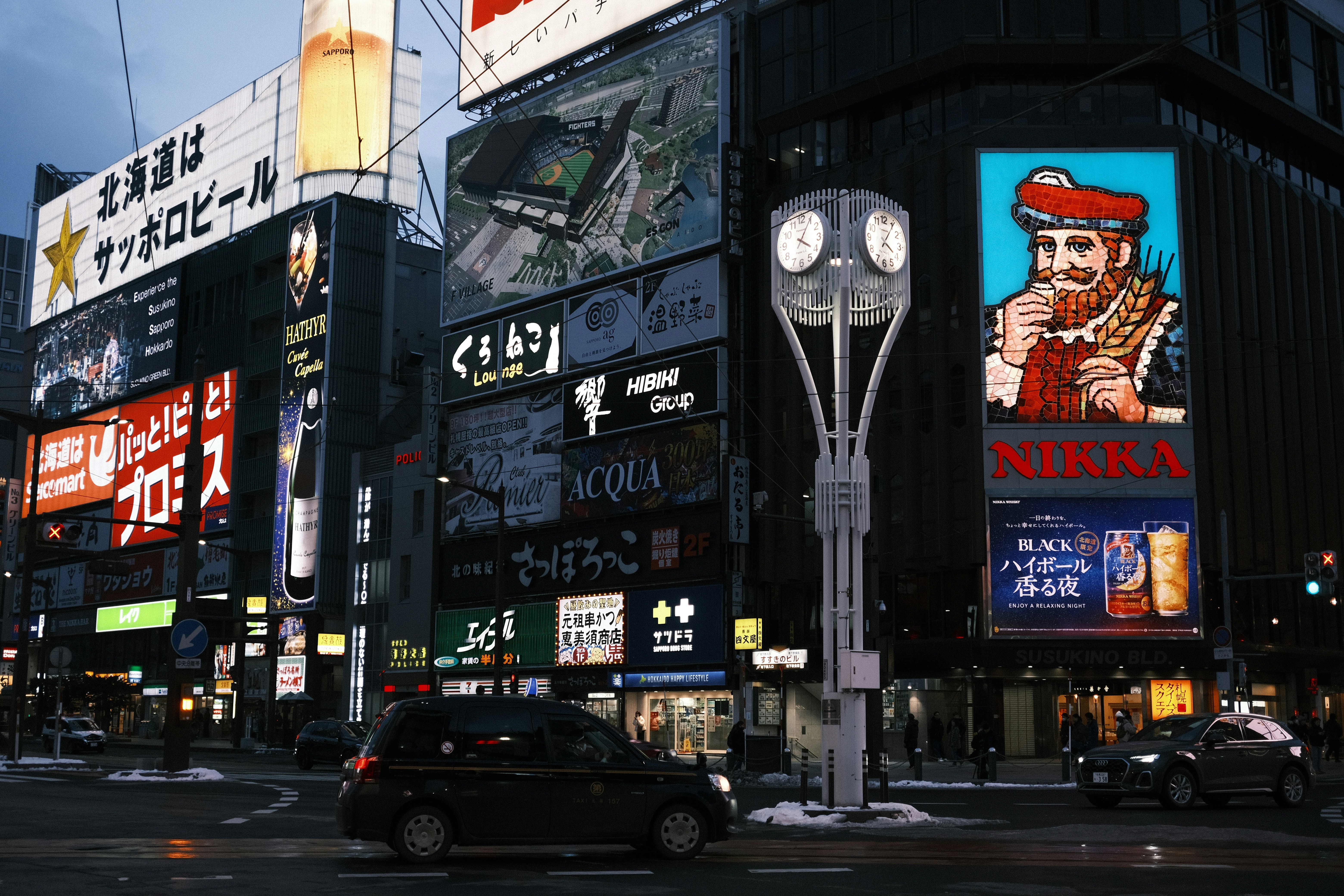 a city street filled with lots of tall buildings