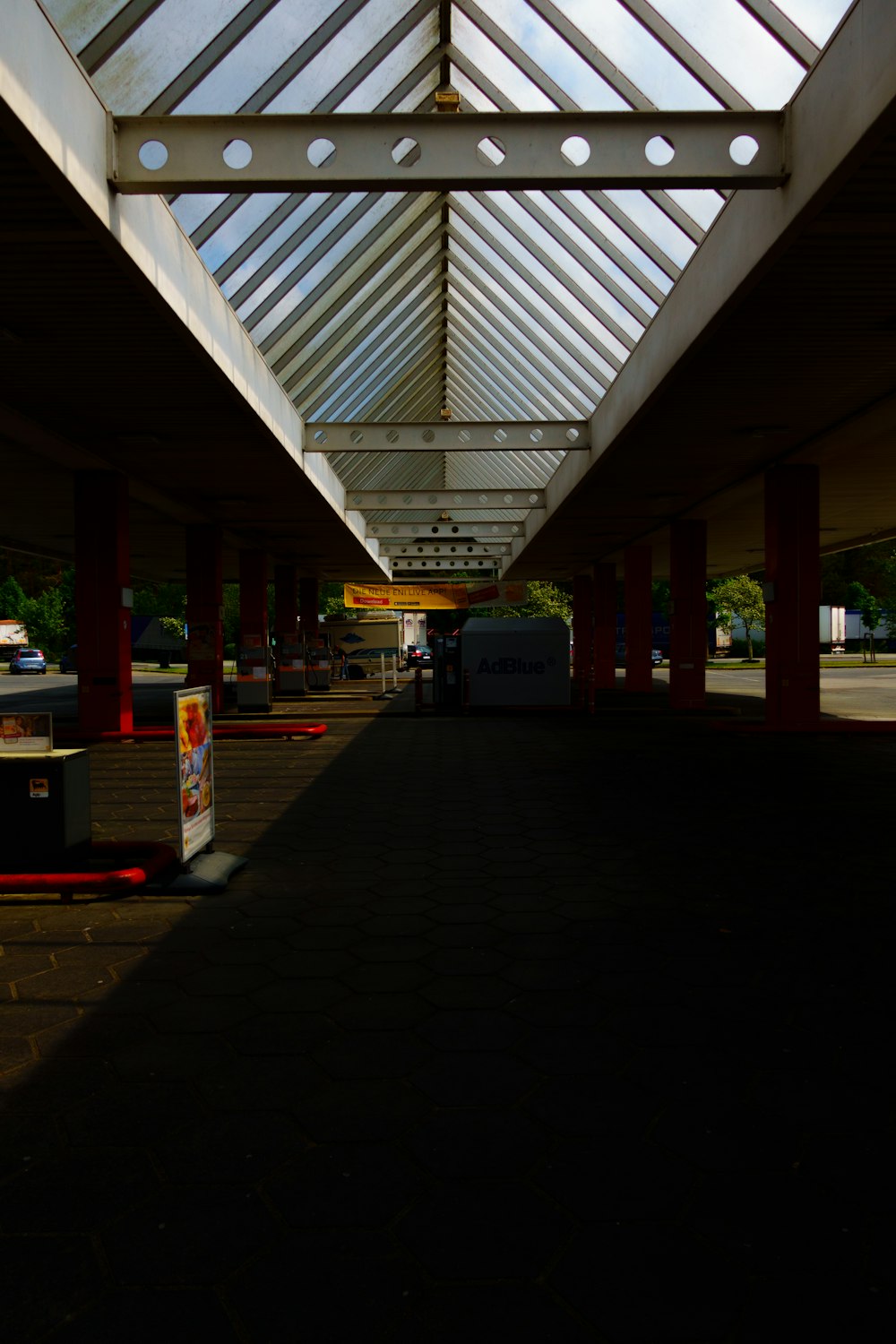 a long walkway with a skylight above it