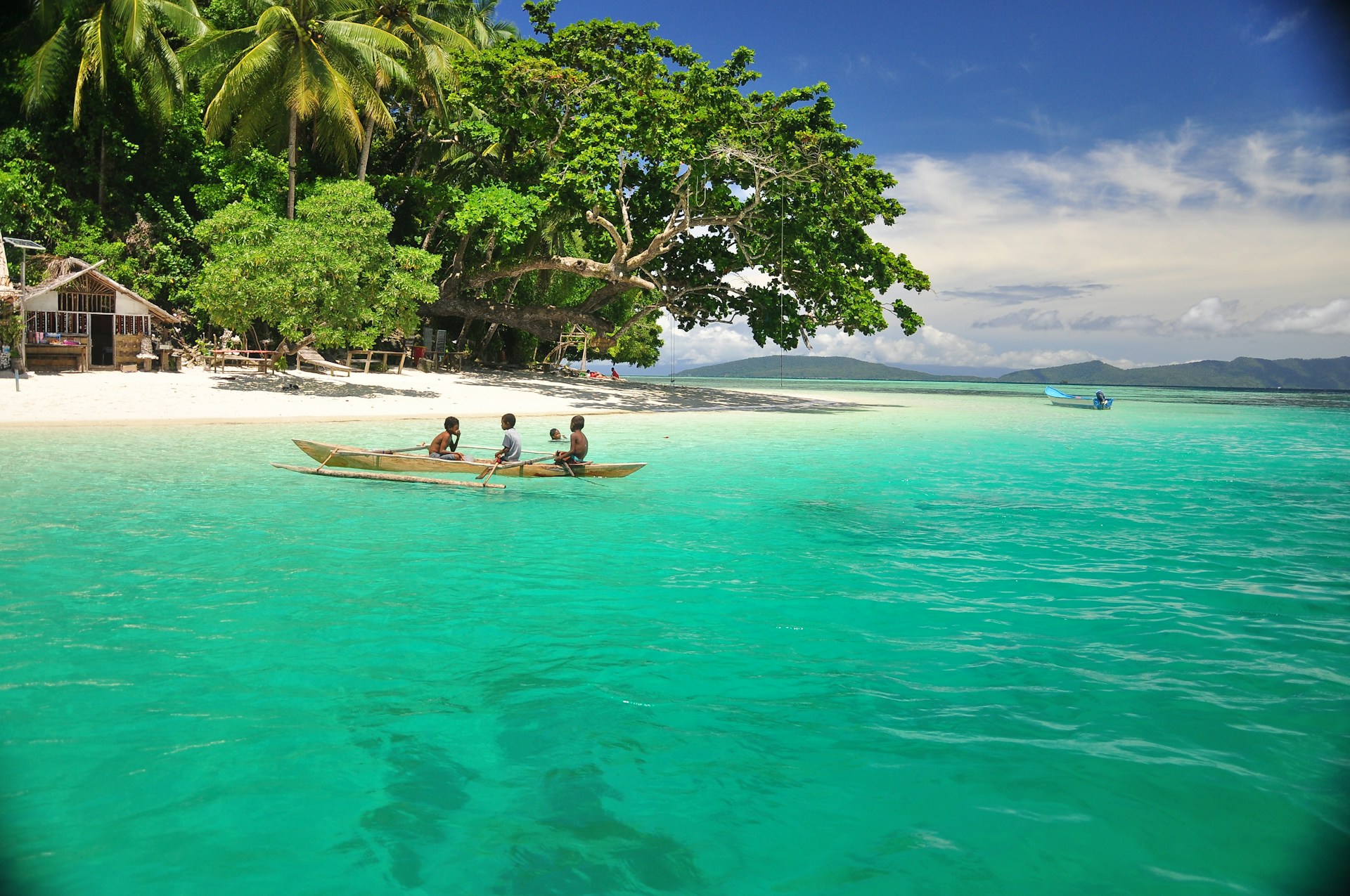 a couple of people in a small boat in the water
