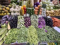 a display in a grocery store filled with lots of vegetables