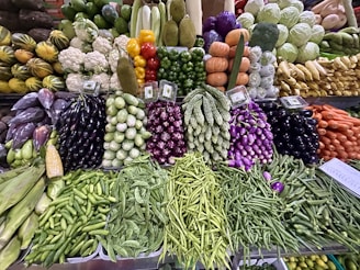 a display in a grocery store filled with lots of vegetables