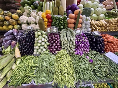 a display in a grocery store filled with lots of vegetables