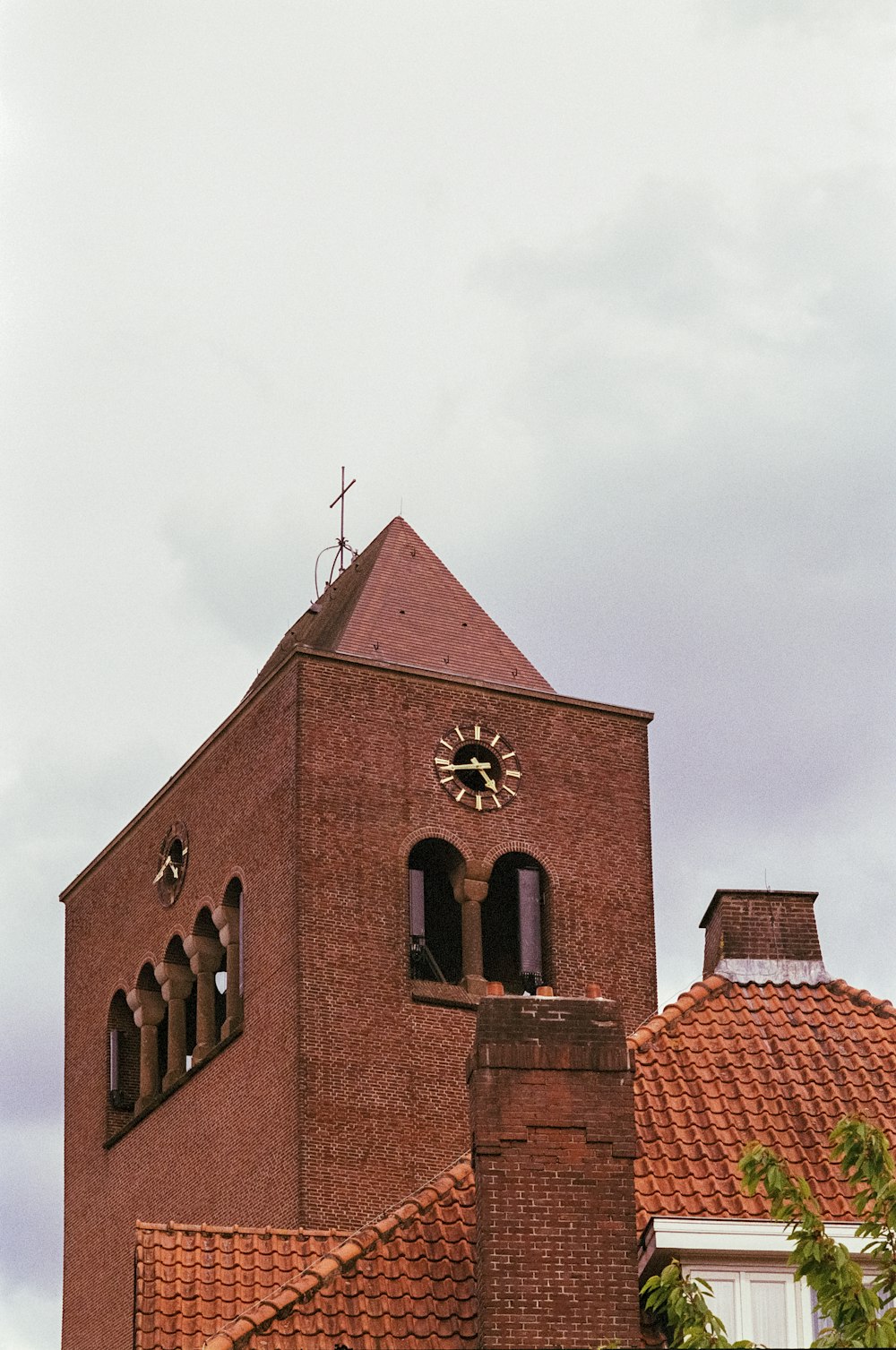 a tall brick building with a clock on it's side