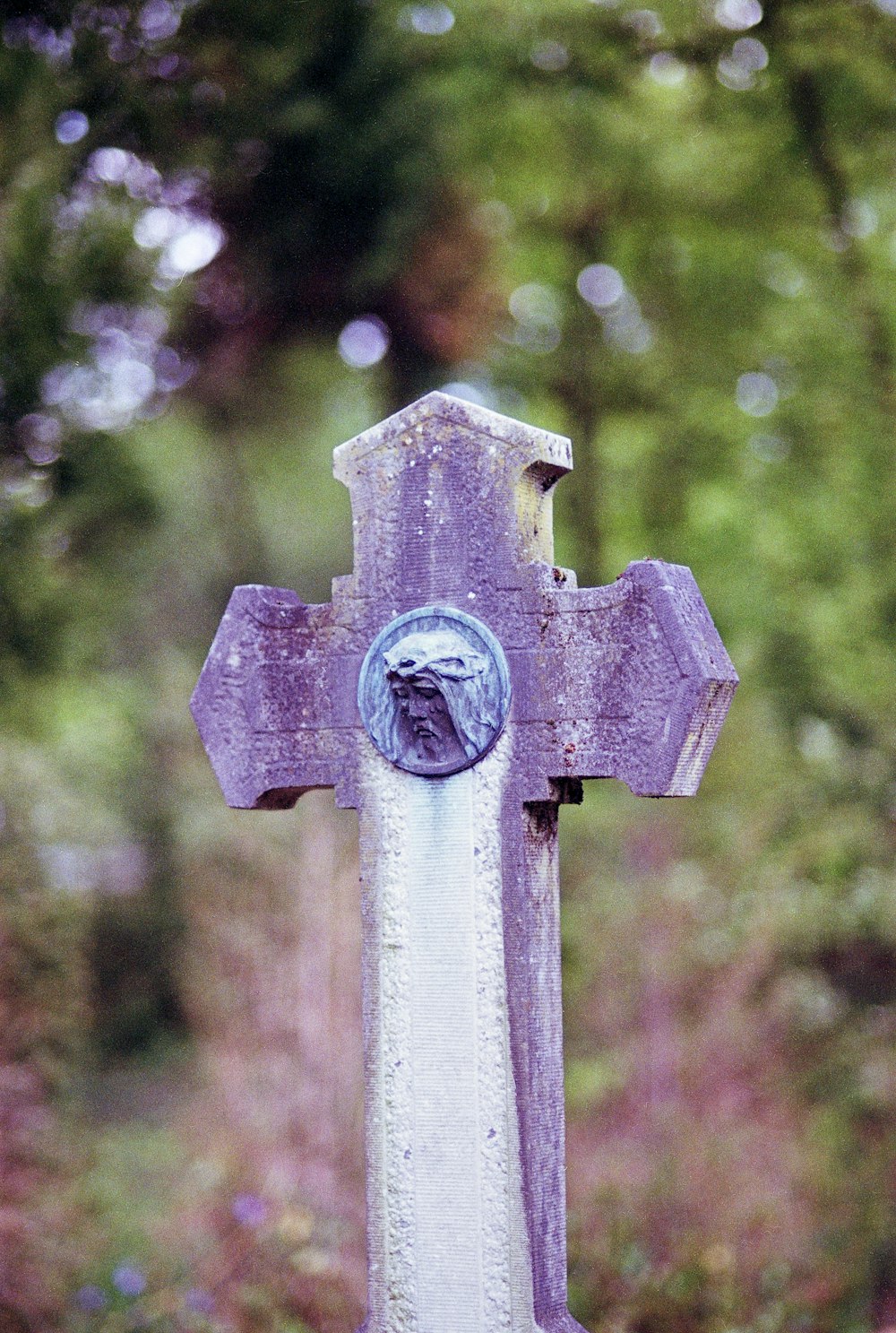 a close up of a cross on a pole