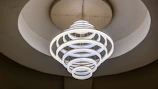 a circular light fixture hanging from the ceiling