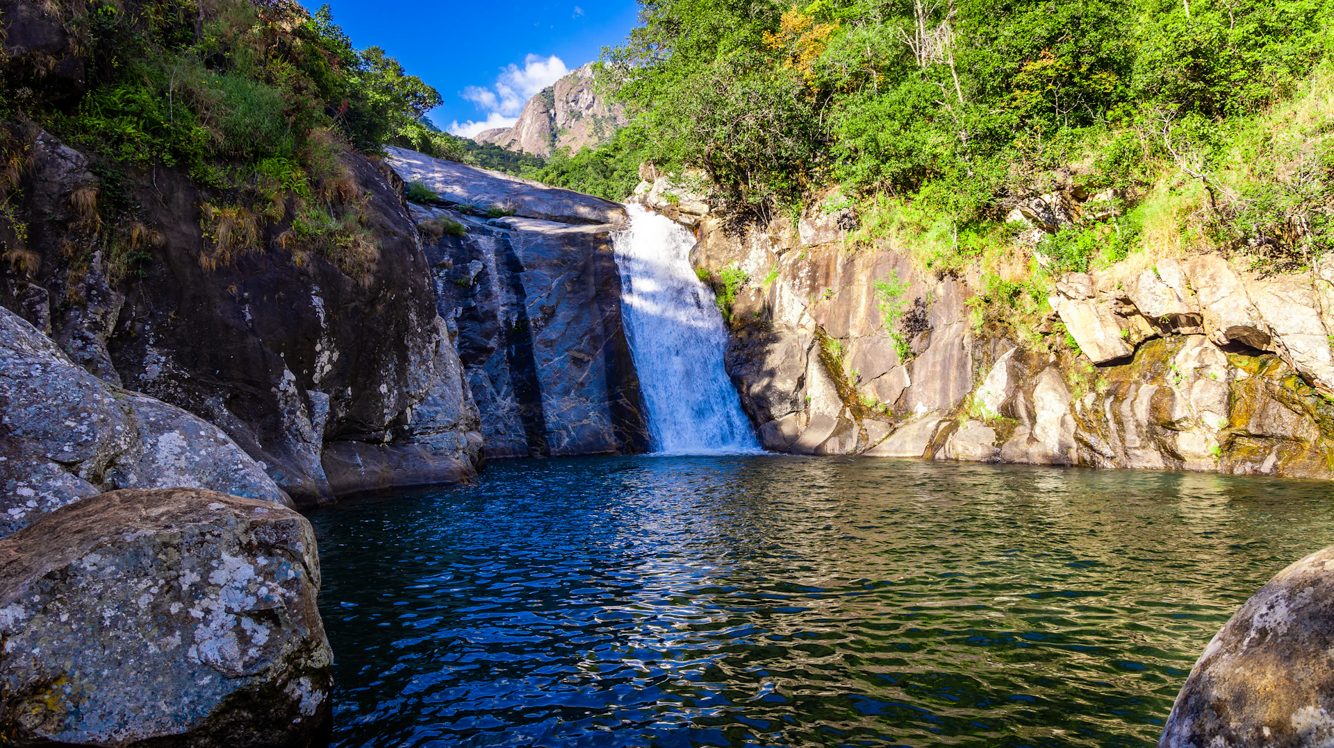 a large waterfall with a waterfall in the middle of it