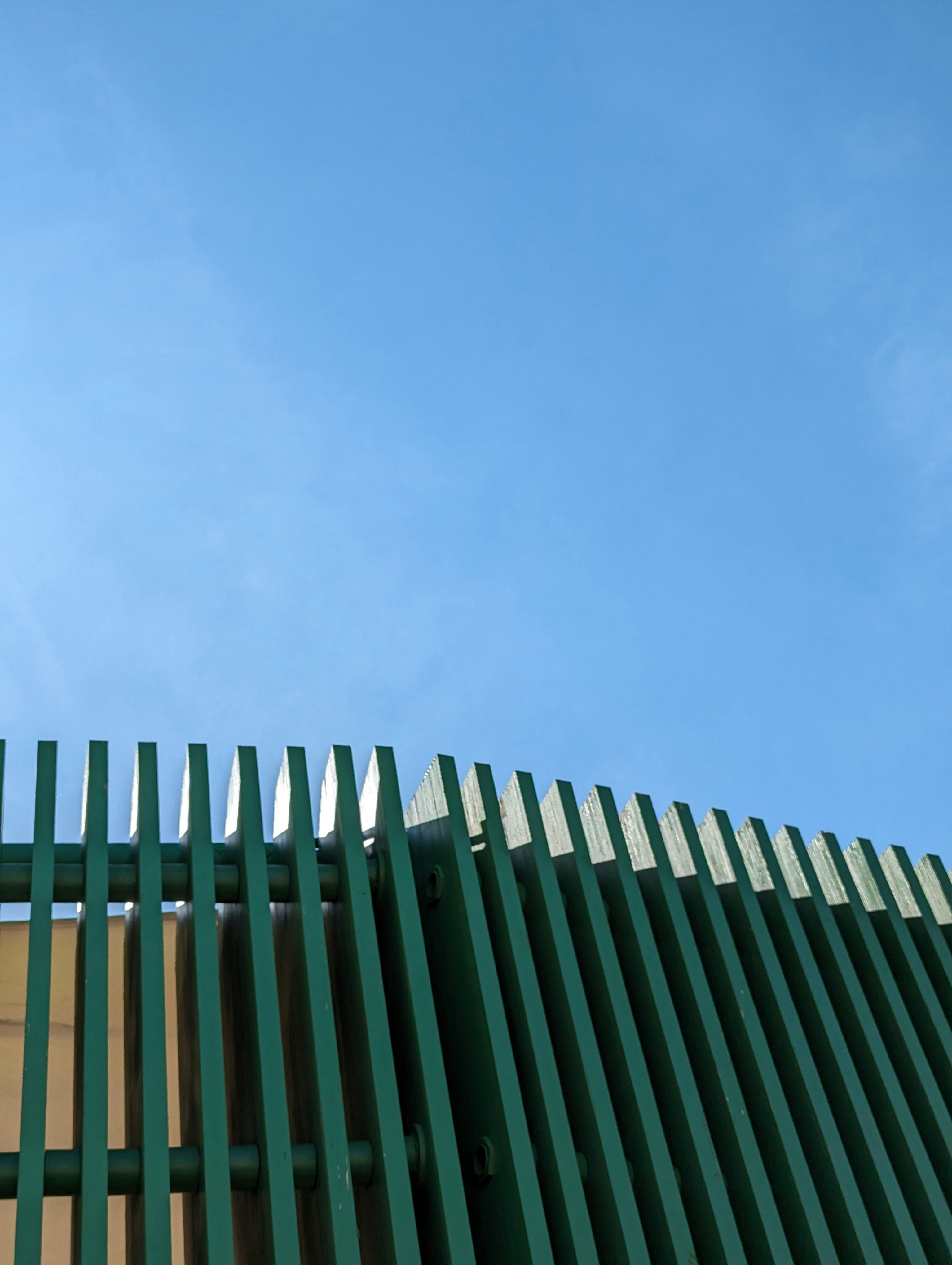 woman wearing yellow long-sleeved dress under white clouds and blue sky during daytime
