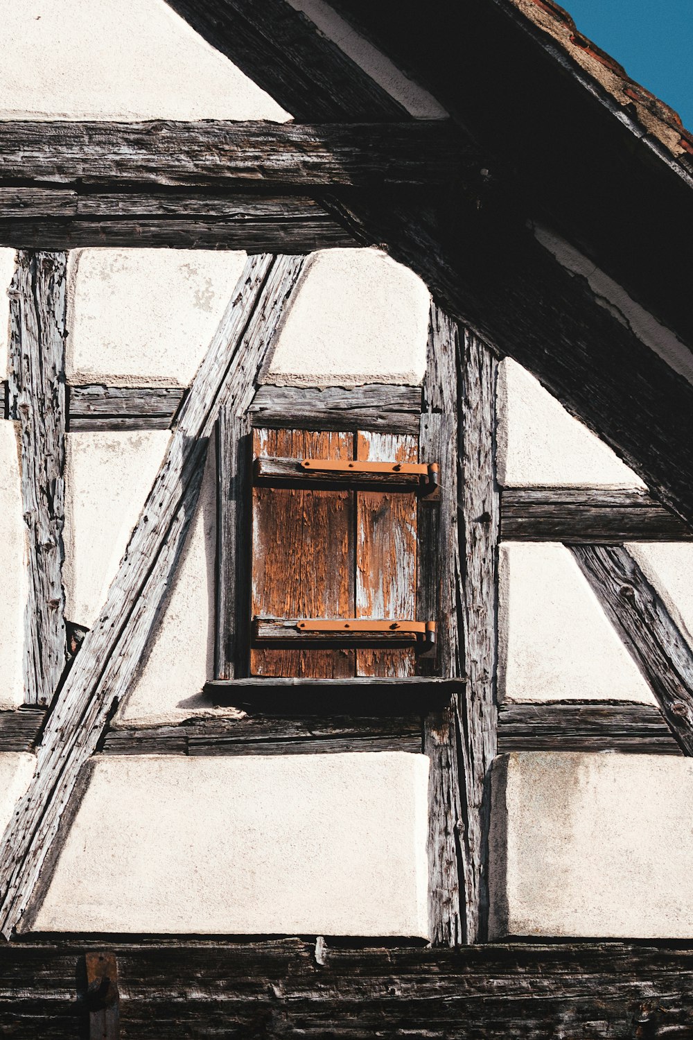 a window in the side of an old building