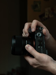 a person holding a camera in their hands