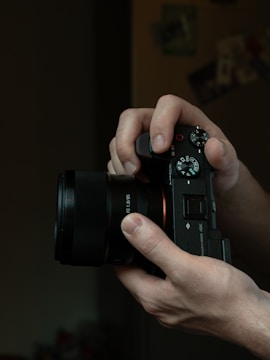 a person holding a camera in their hands