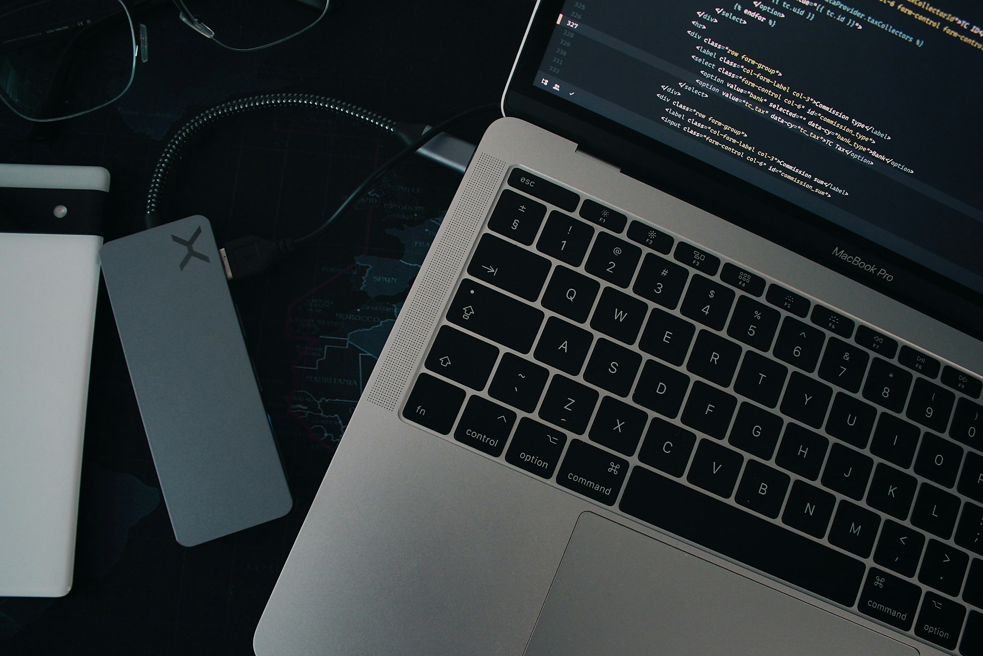 a laptop computer sitting on top of a desk