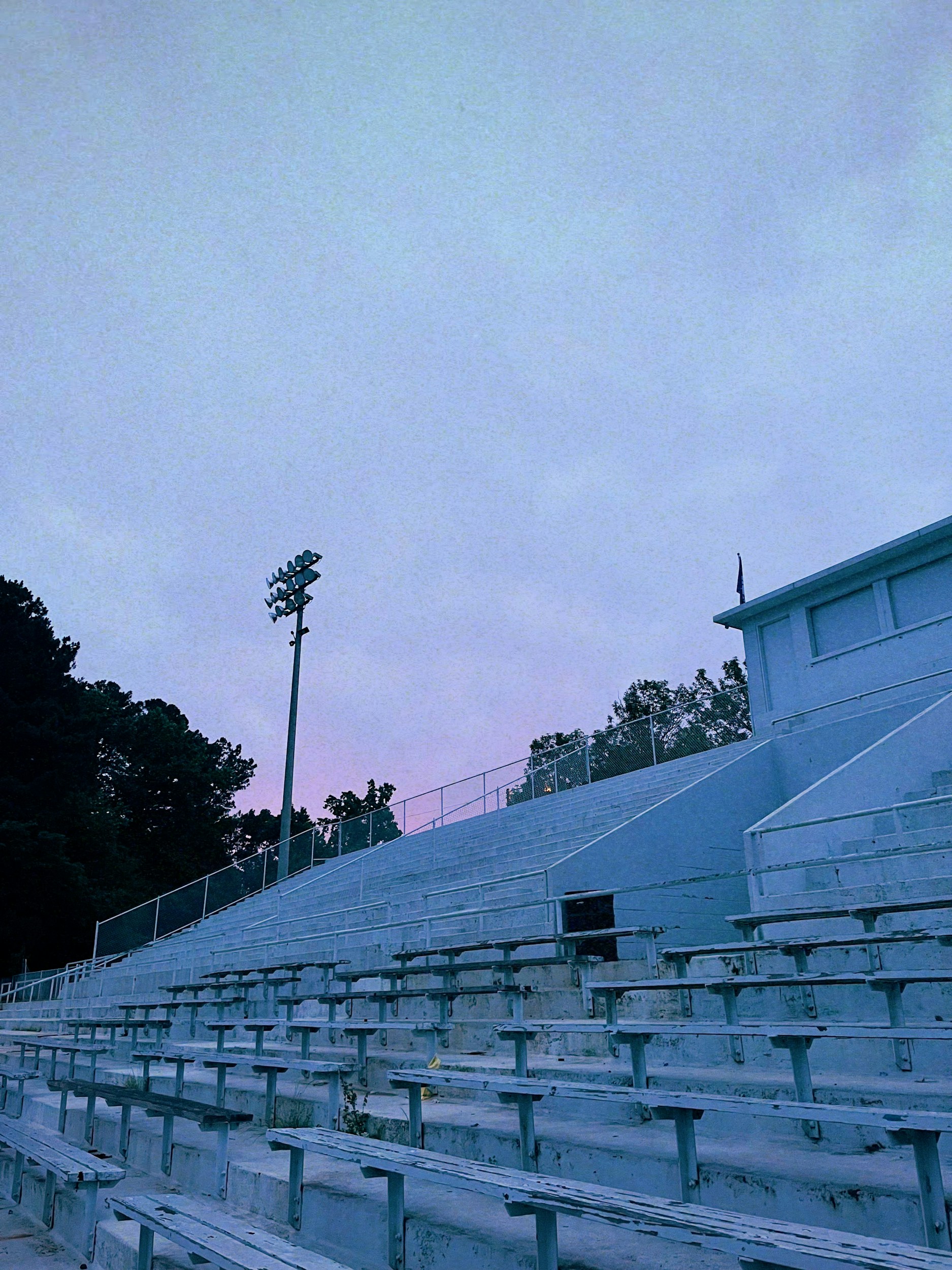 empty football stadium seats dusk