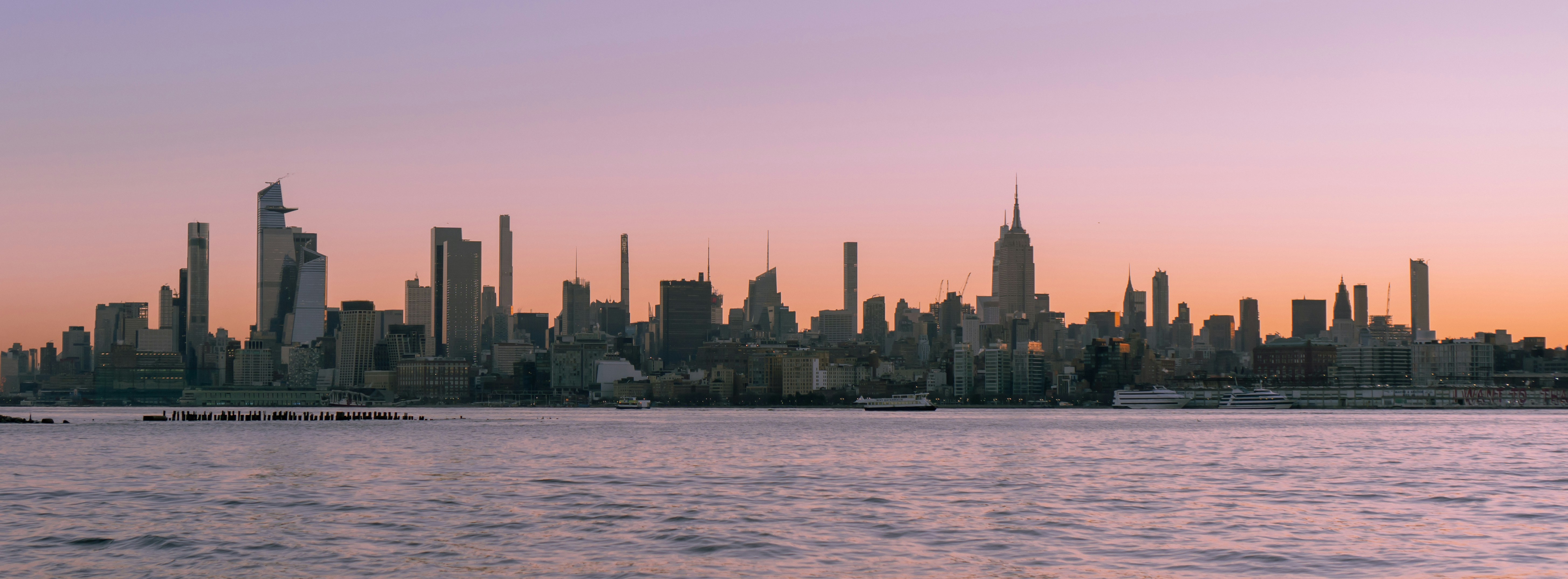 A large body of water with a city in the background
