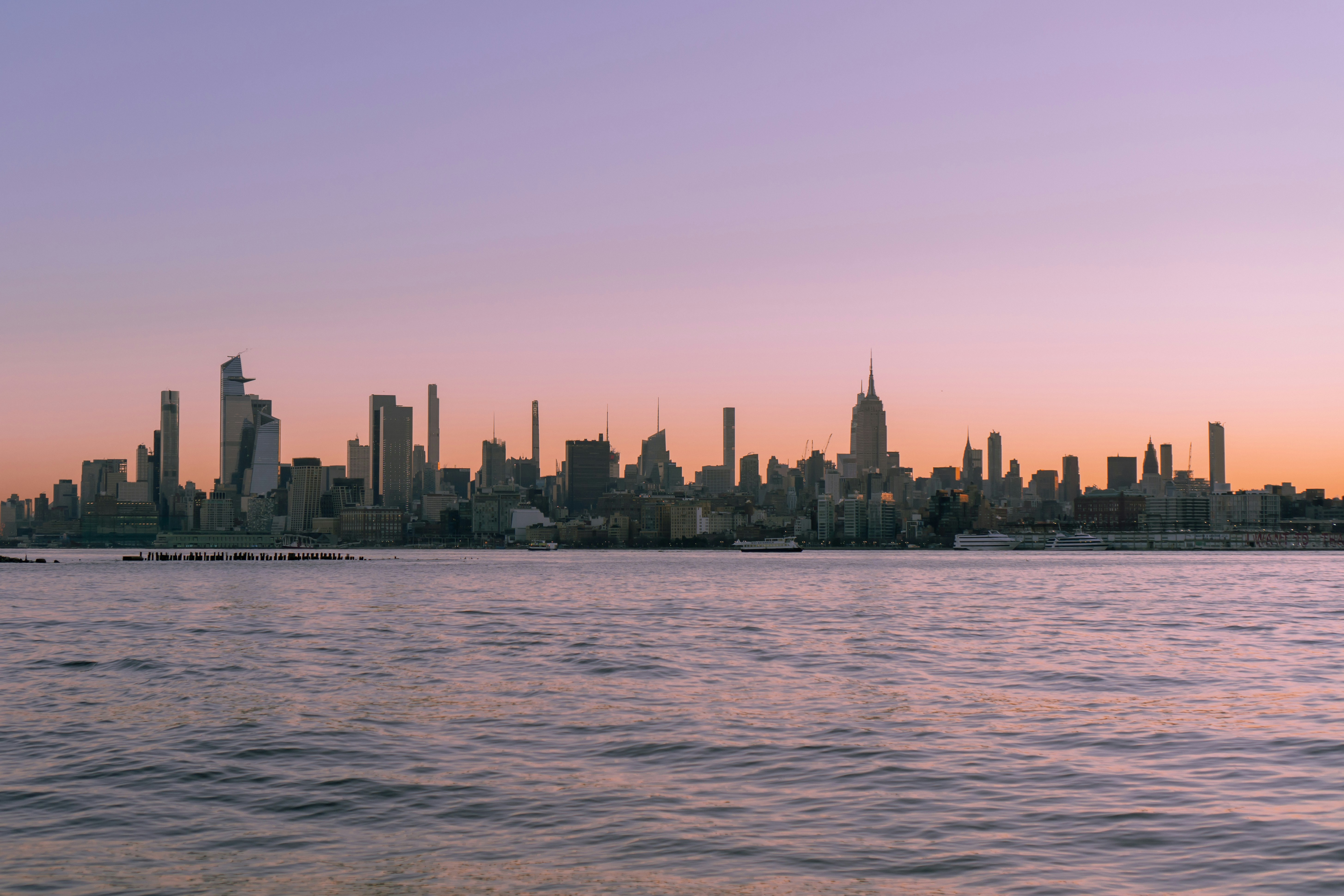A large body of water with a city in the background