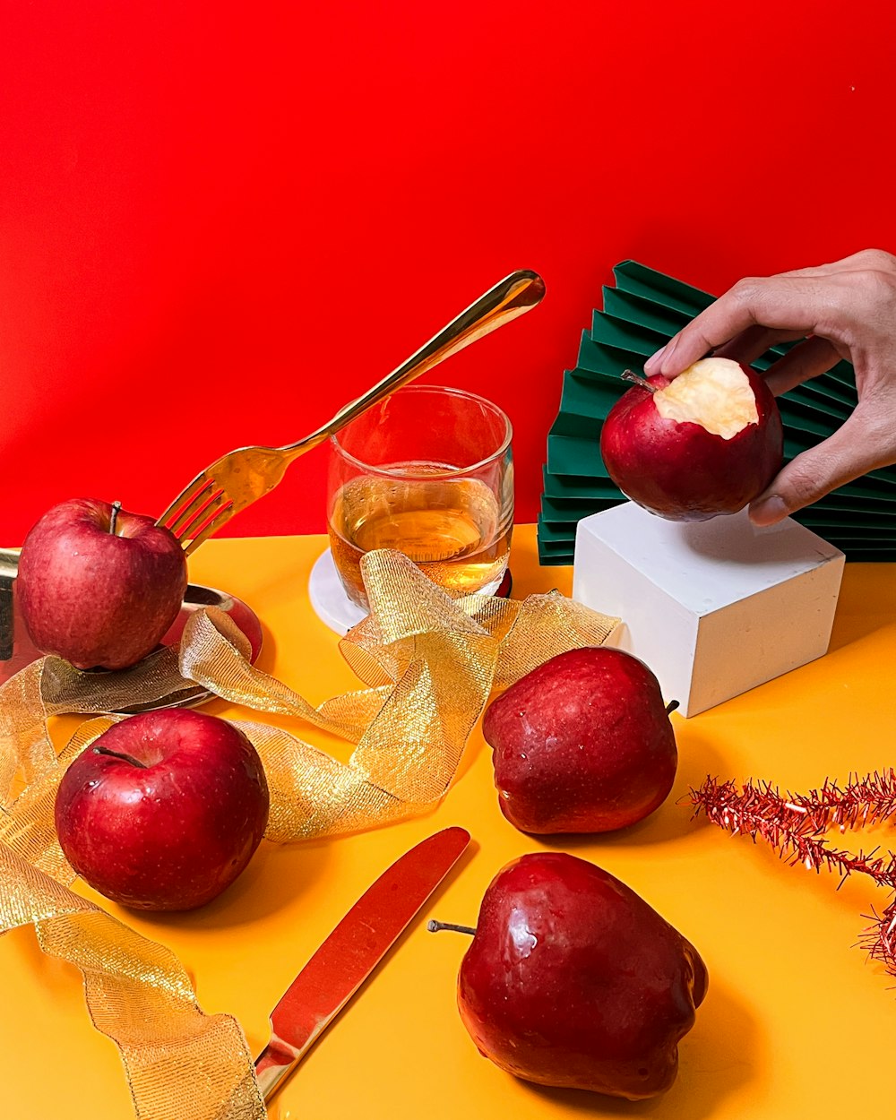 a person is peeling an apple with a knife